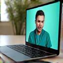 A laptop screen showing a virtual consultation with a doctor, emphasizing remote preventive care.