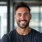 A confident, professional male exercise physiologist with a fit build, depicted in a modern, clean gym or wellness center environment.